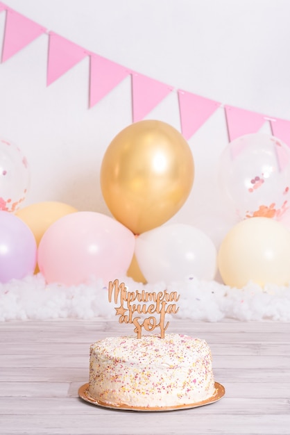 birthday cake with colored balls. Topping where it says "my first return to the sun". Birthday celebration. Baby's first year.