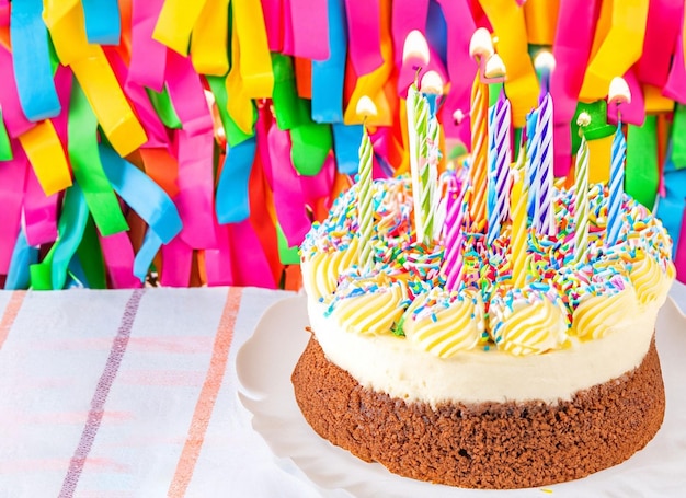 Birthday cake with colorful candles for copy space