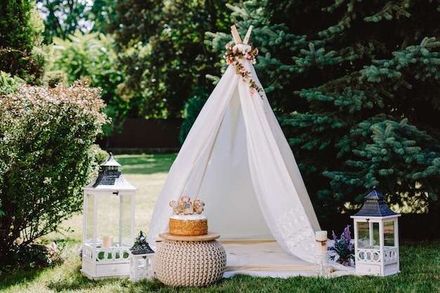 Birthday celebration in nature indian wigwam for children's birthday Cake and tender reproach