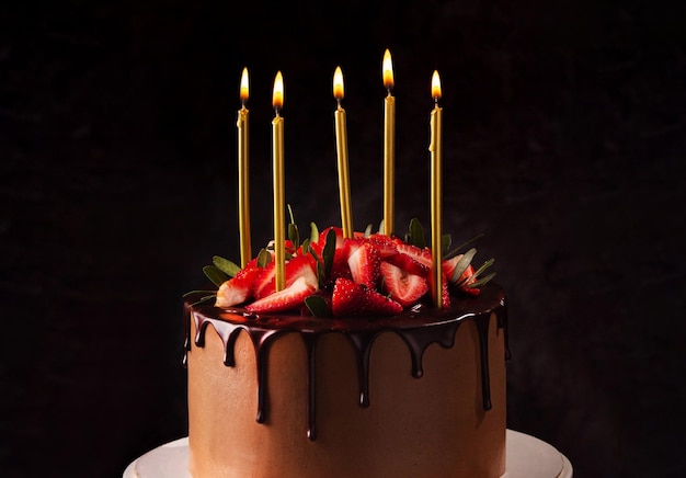 Birthday chocolate cake with candles Candles on top of a birthday cake