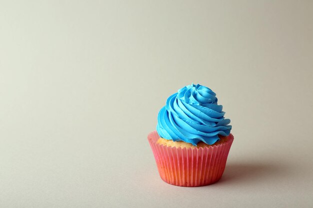 Birthday cupcake on color background