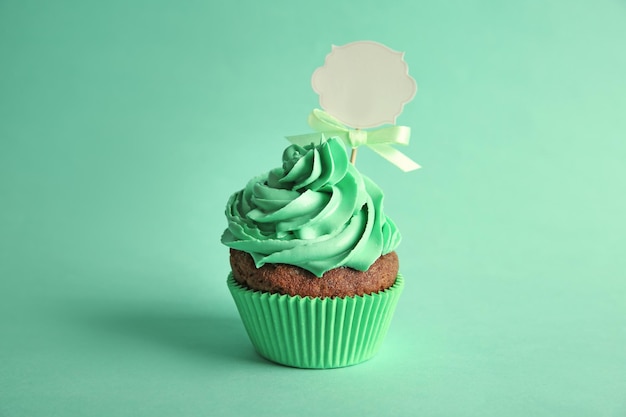 Birthday cupcake with space for text on green background