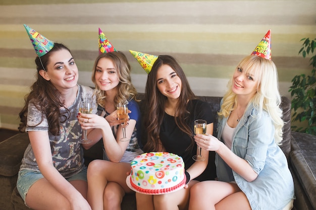 Birthday. Girls posing with cake on birthday.