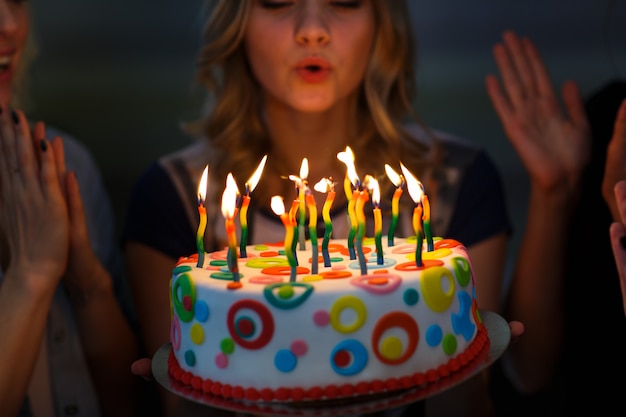 Photo birthday. girls with a cake with candles.