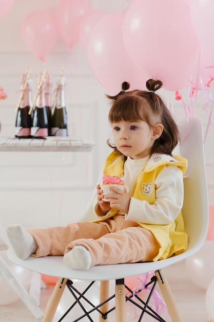 Birthday of a little girl with pink decor Pink balloons festive children's table