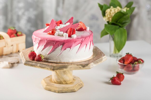 Biscuit cake with strawberry filling and fresh strawberries