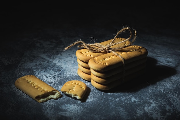 Biscuits tied with a rope on an abstract background