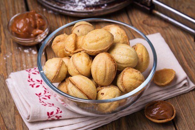 Biscuits with condensed milk in a transparent plate