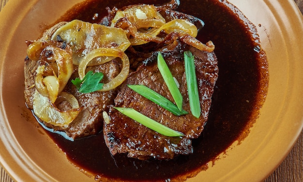 Bistek -  Mexican dish of pieces of salted and peppered sirloin,served in tortillas as a taco.