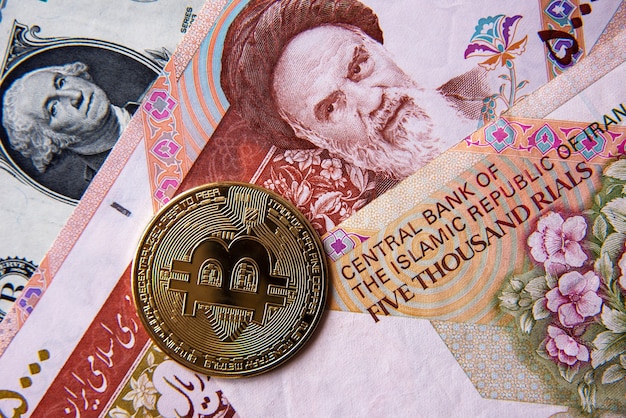 Bitcoin against Iran rials and American dollar, close-up image. Conceptual image of digital crypto currency against world traditional currency