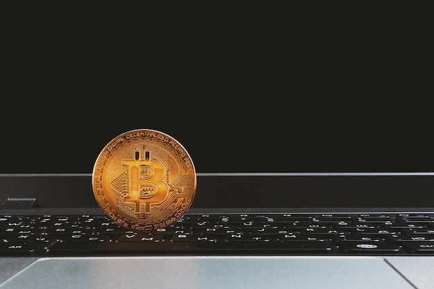 Bitcoin on black laptop keyboard