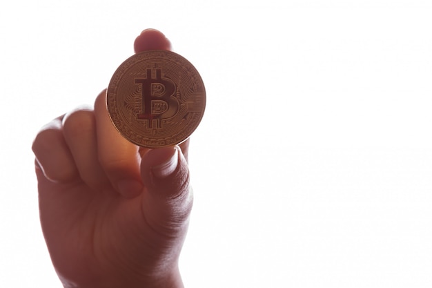 Bitcoin BTC in een vrouwelijke hand