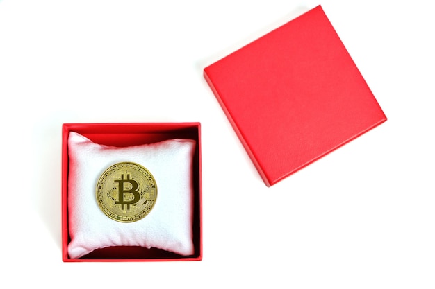 Bitcoin coin in a red gift box on a white background.Mining gift for Valentine's Day.