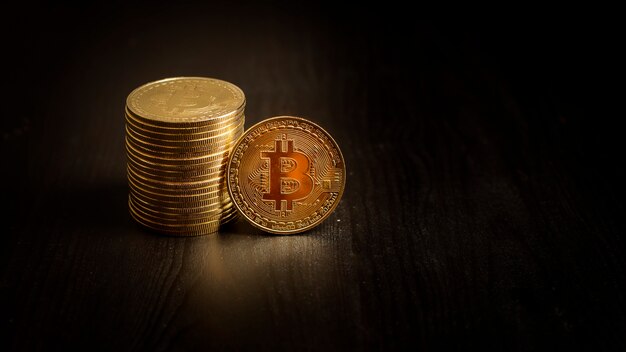  Bitcoin coins on black background 