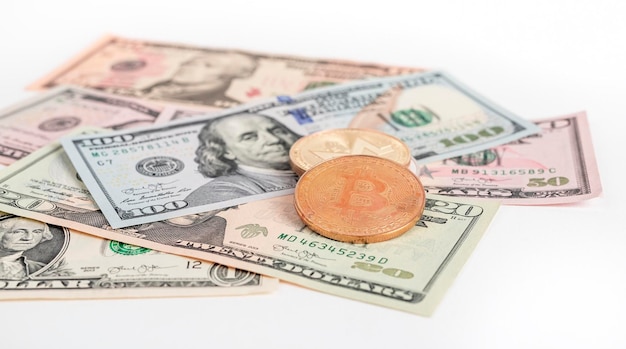 Bitcoin coins at dollar bills pile cryptocurrency and cash money concept high quality photo