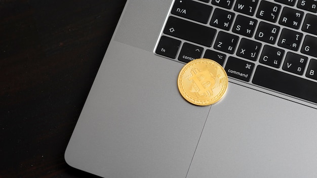 Bitcoin coins on a laptop keyboard