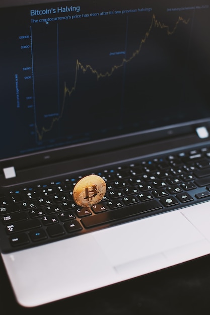 Photo bitcoin on computer keyboard and growth chart