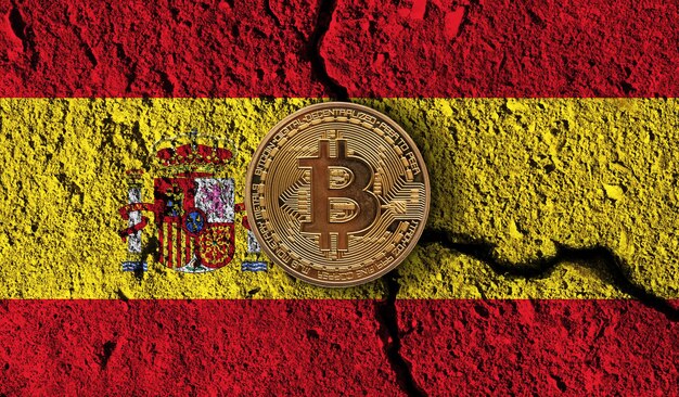 Bitcoin crypto currency coin with cracked spain flag crypto restrictions