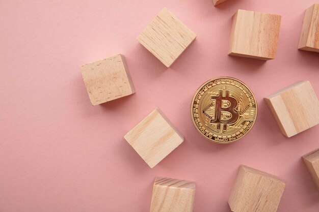 Bitcoin cryptocurrency coin blockchain technology concept coin with wood block