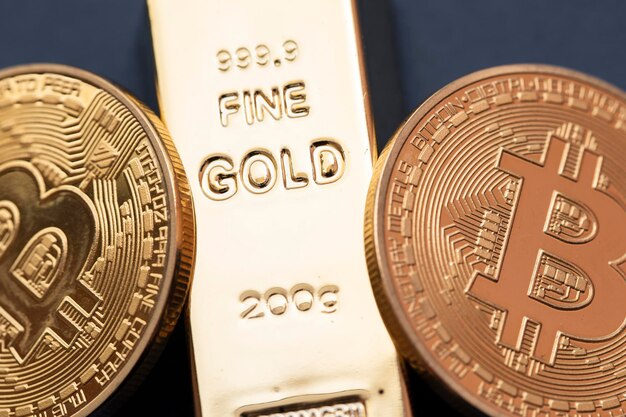 Bitcoin cryptocurrency coin with a gold bullion bar investment concept