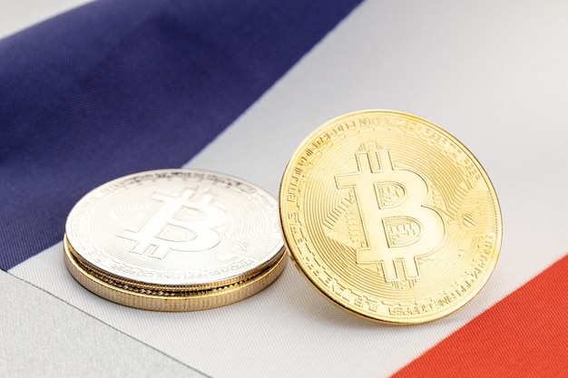 Bitcoin cryptocurrency coins on national flag of France. Crypto law regulation concept