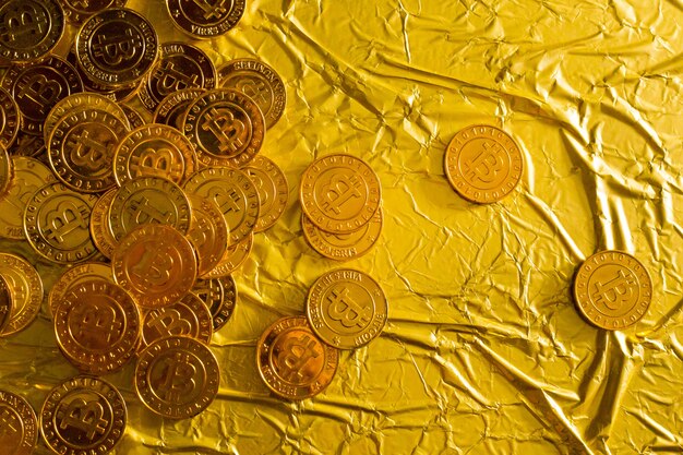 The Bitcoin cryptocurrency in gold texture image background