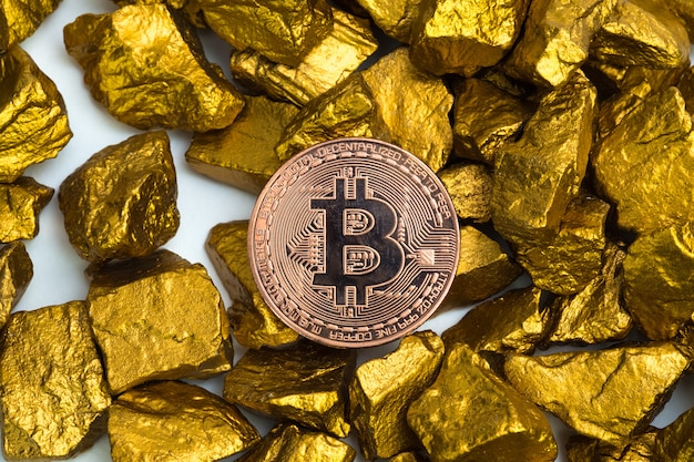 bitcoin digital currency and gold nugget or gold ore