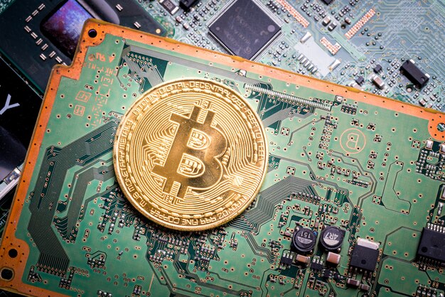 Bitcoin, the digital currency in studio on motherboard