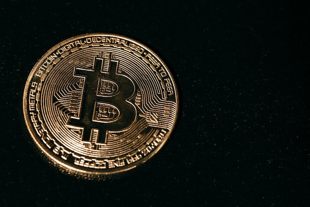 Bitcoin Golden bitcoin isolated on dark background