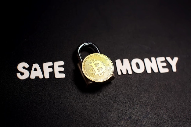 Bitcoin and lock with text safe money cryptocurrency investment\
security and safety concept