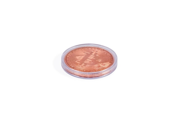 Bitcoin souvenir coin in a plastic transparent box isolated on white background