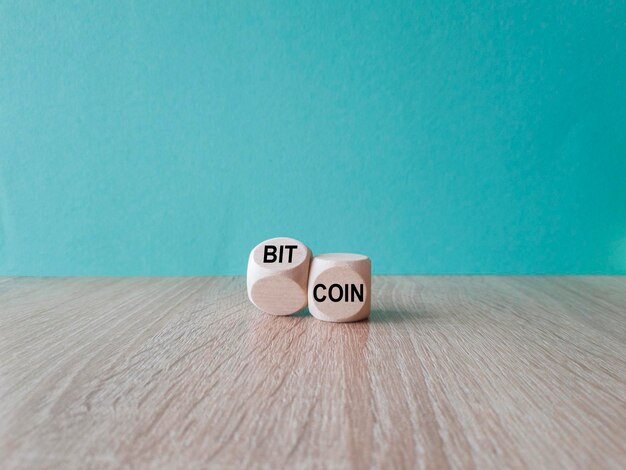 Photo bitcoin symbol turned the wooden cube and changed the word coin to bitcoin