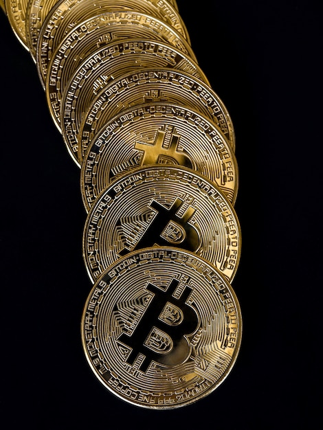 Bitcoin technology background. Golden bitcoin on black background, cryptocurrency investment concept, vertical style. Digital future coin currency financial background.