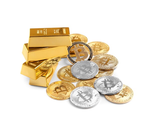 Bitcoins and gold bars isolated