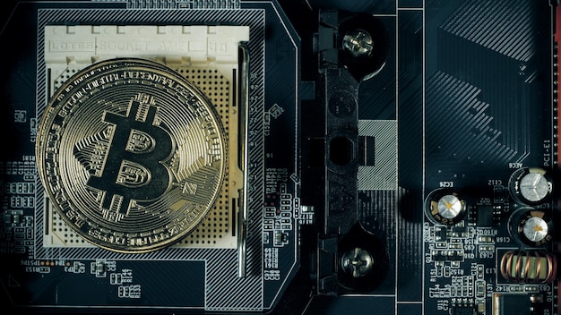 Bitcoins on the motherboard. Crypto currency Gold Bitcoin - BTC - Bit Coin.