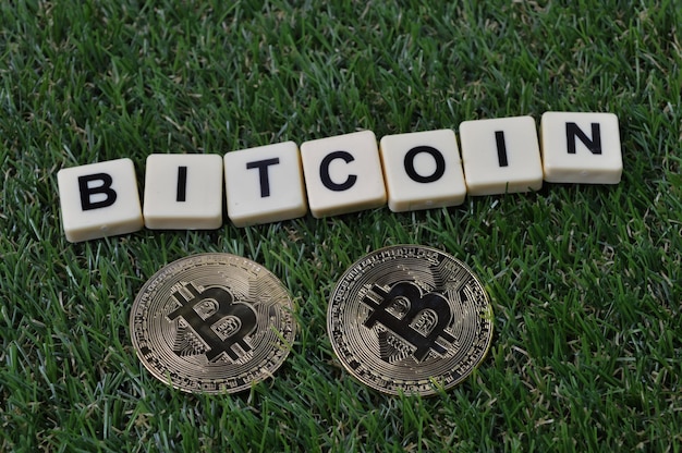 Bitcoins and scrabble letters with text BITCOIN