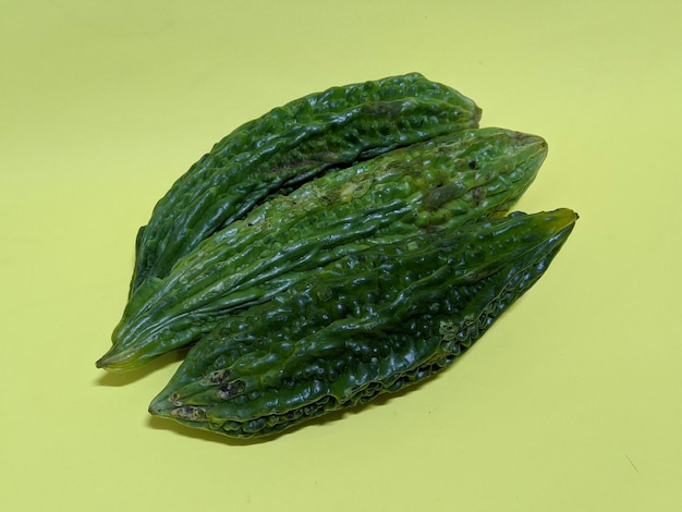 Bitter gourd vegetables on yellow background