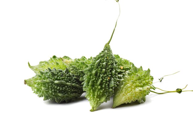 Photo bitter melon or bitter gourd on white background