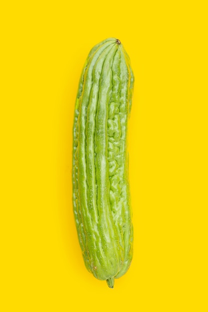 Bitter melon on yellow background.