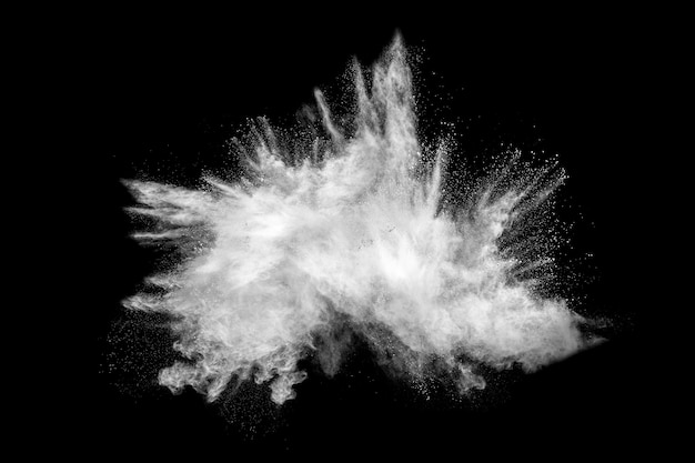 Bizarre forms of white powder explosion cloud against black background.White dust particles splash.