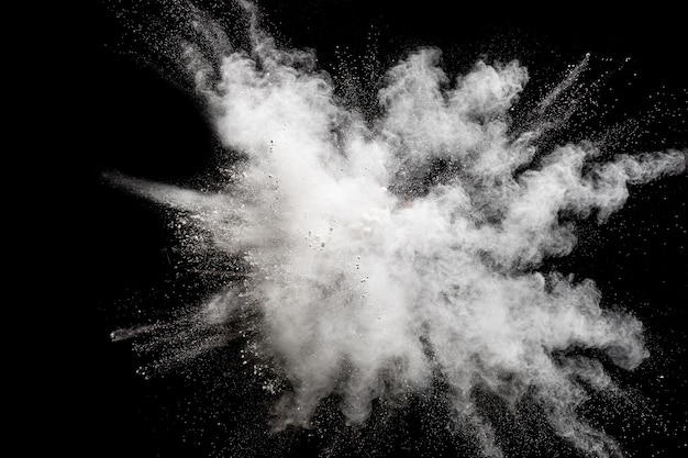 Photo bizarre forms of white powder explosion cloud against black background.