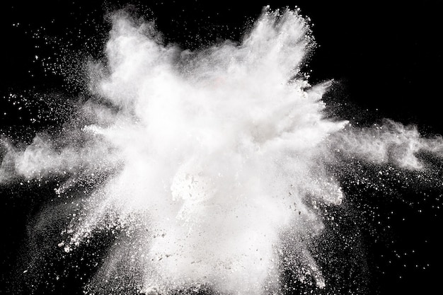 Bizarre forms of  white powder explosion cloud against dark background