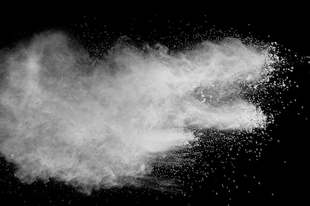 Bizarre forms of  white powder explosion cloud against dark background