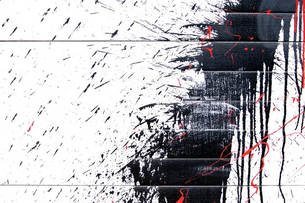 Black abstract paint splashes on white