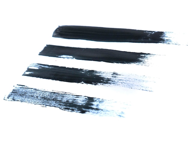 Photo black acrylic paint stroke isolated on white background abstract art concept