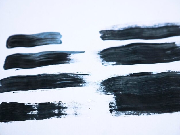 black acrylic paint stroke isolated on white background abstract art concept