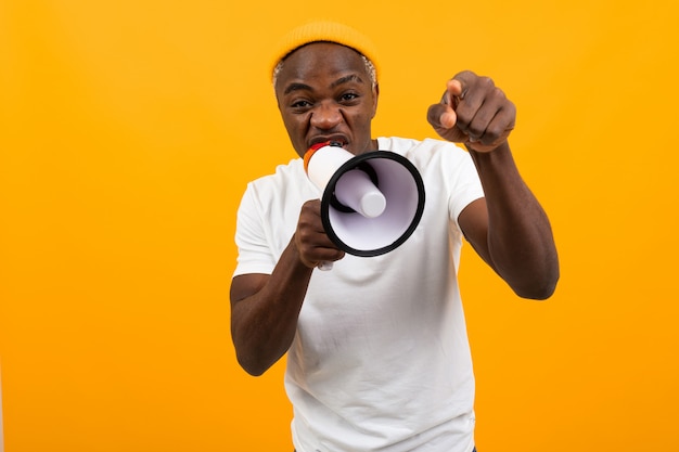 Black african man shouting into a megaphone