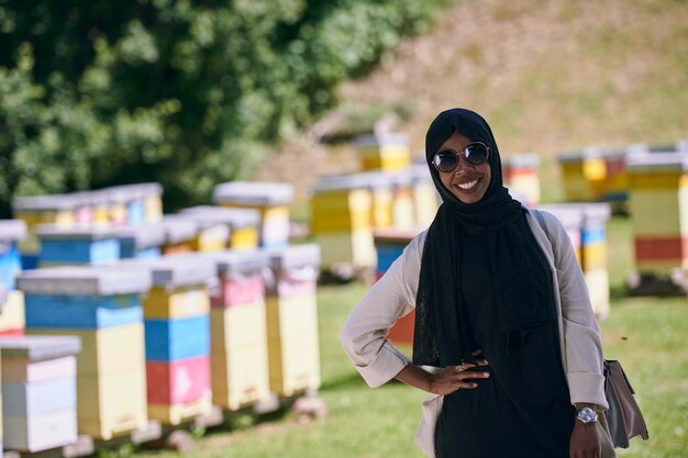 black african muslim businesswoman portrait  on small local  honey production farm