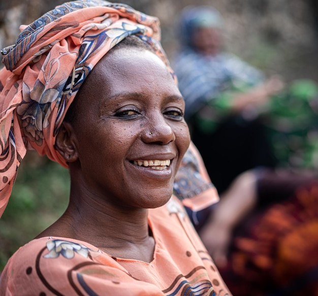 Black African senior beautiful woman with scarf outdoors portrait