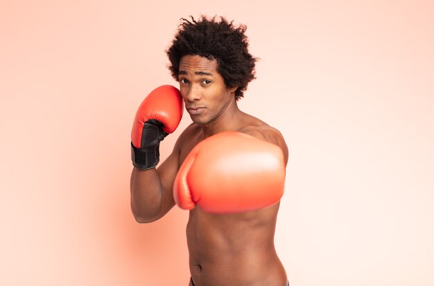 Black afro man boxing